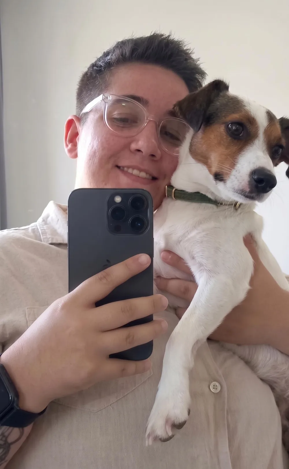 Marie, founder of Hartwork, holding Zoe the Jack Russell terrier